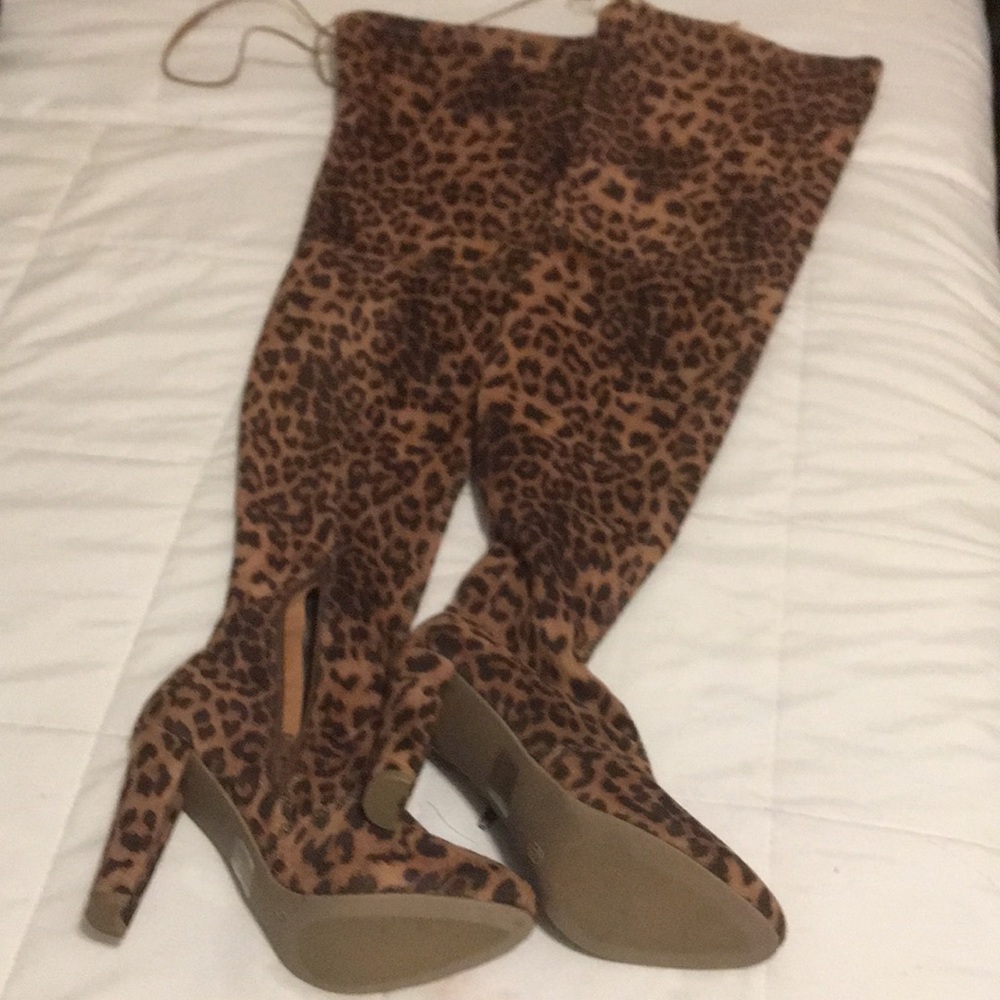 Stretched over the knee tiger print heeled boots